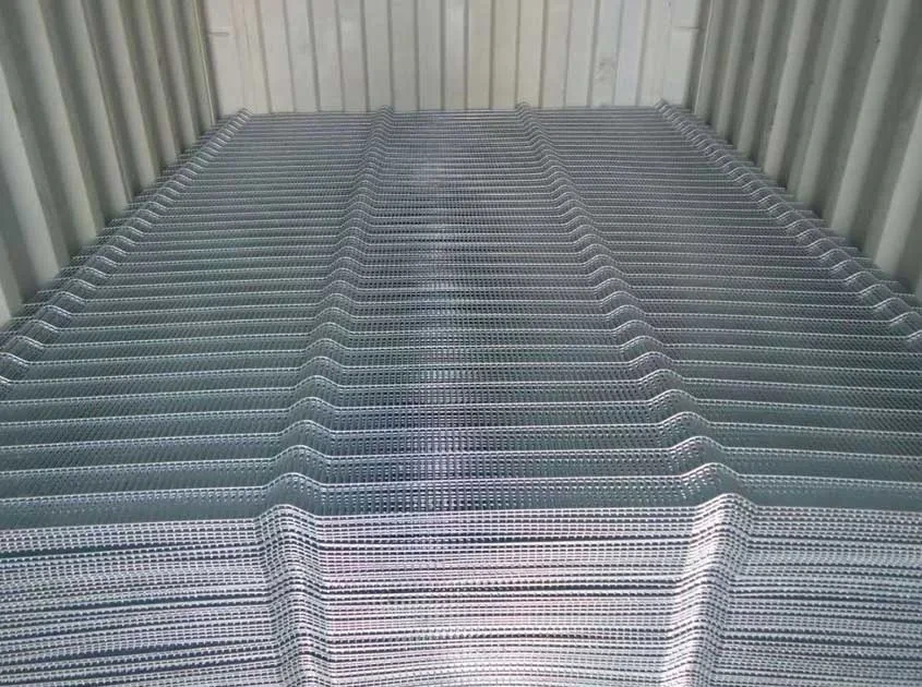Profiled mesh fence panels stacked inside a shipping container