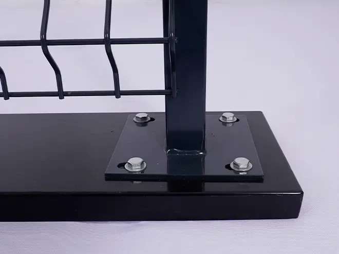 Fence post welded to a base plate with four visible fixings
